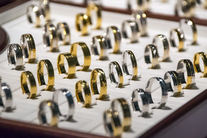 White and yellow rings lined up in an elegant display